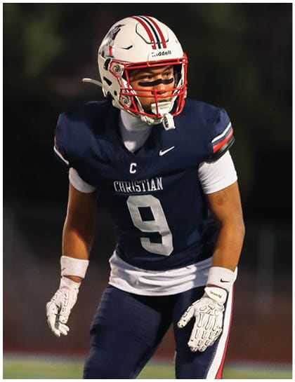 A football player wearing a blue jersey with the number 58 on it. Description generated by AI