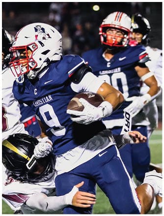 A football player running on the field. Description generated by AI