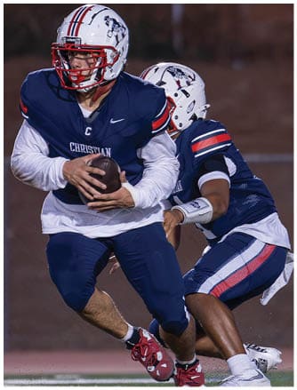 A football player running on the field. Description generated by AI