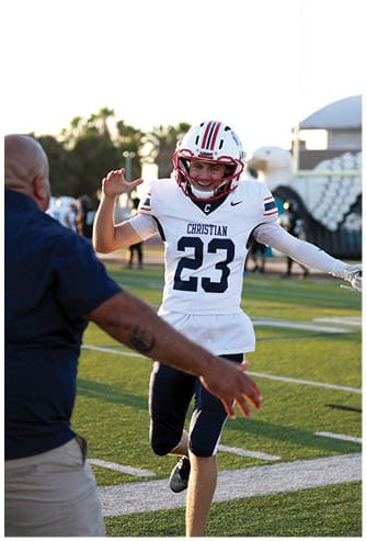 A football player running on the field. Description generated by AI
