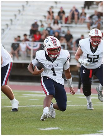 A football player running on the field. Description generated by AI