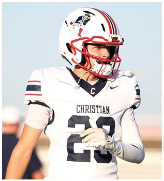 A football player running on the field. Description generated by AI