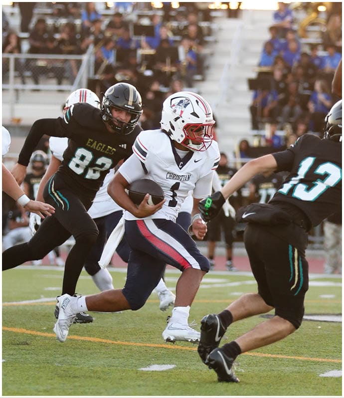 A group of football players wearing black and white uniforms. Description generated by AI