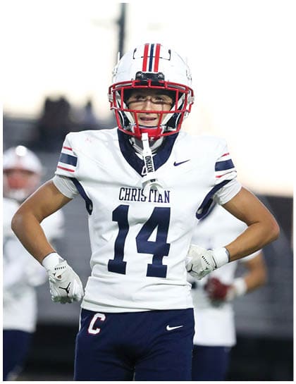 A football player wearing a blue jersey with the number 58 on it. Description generated by AI