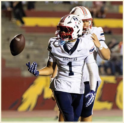 A football player is kicking a football on a field. Description generated by AI