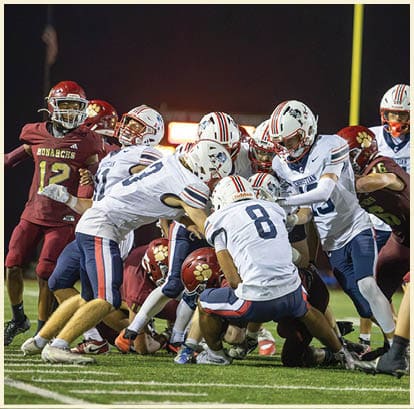 A football player is kicking a football on a field. Description generated by AI