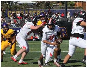 A football player running on the field. Description generated by AI