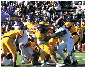 A football player running on the field. Description generated by AI