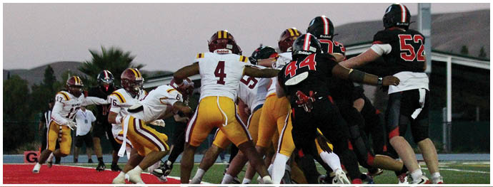 A football player is sliding on the ground. Description generated by AI
