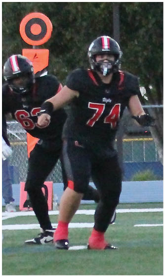 A football player running on the field. Description generated by AI