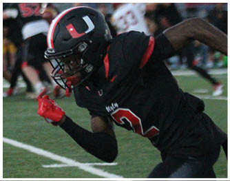 A football player running on the field. Description generated by AI