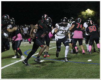 A football player running on the field. Description generated by AI