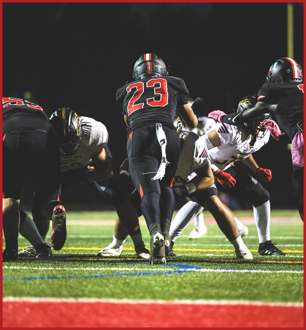 A football player running on the field. Description generated by AI