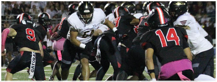 A football player is sliding on the ground. Description generated by AI