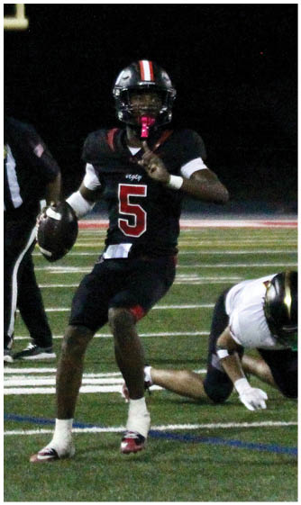 A football player running on the field. Description generated by AI