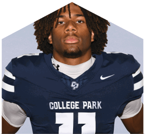A person with curly hair wearing a dark blue football jersey with the words “College Park" and the number zero stands against a plain light background. Descripci n generada con IA