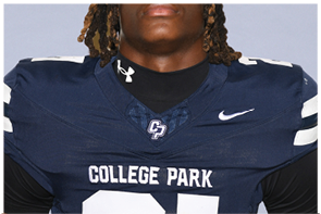 A person wearing a navy blue College Park football jersey with white lettering and a Nike logo. Descripci n generada con IA