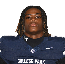 Person with shoulder-length dreadlocks wearing a dark blue College Park football jersey with the number 21. Descripci n generada con IA