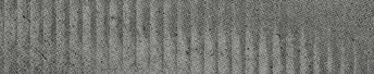 A close-up view of a textured surface with vertical ridges and a rough, grayish pattern. Descripci n generada con IA