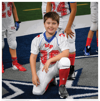 A football player wearing a blue and red jersey. Description generated by AI
