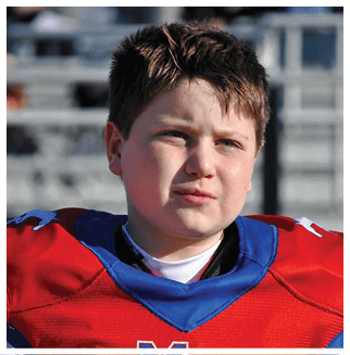 A football player wearing a blue and red jersey. Description generated by AI