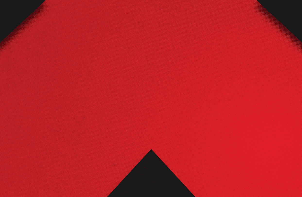 A red and black triangle. Description generated by AI