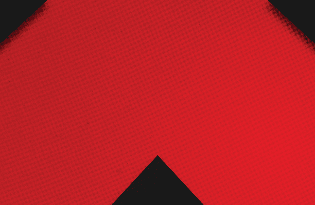 A red and black triangle. Description generated by AI