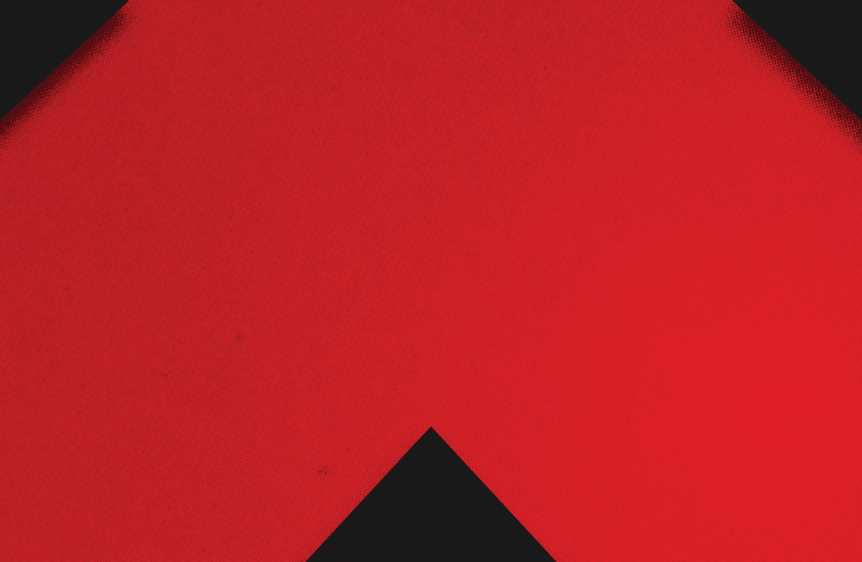 A red and black triangle. Description generated by AI