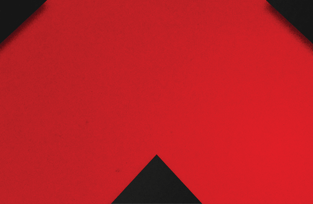 A red and black triangle. Description generated by AI