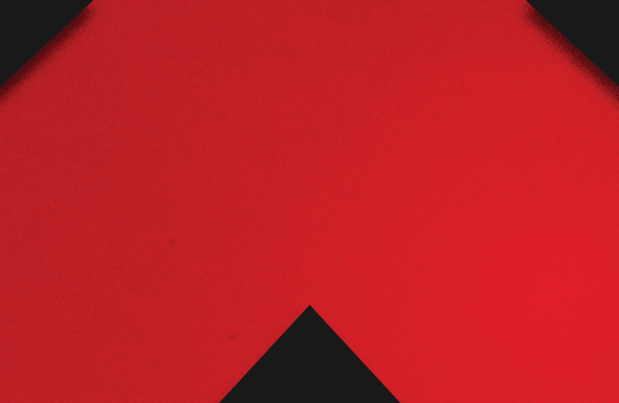 A red and black triangle. Description generated by AI