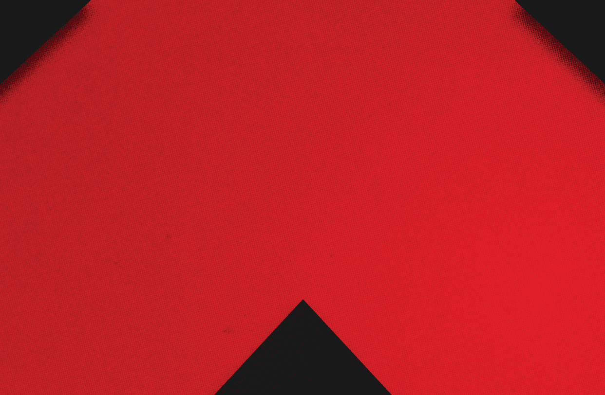 A red and black triangle. Description generated by AI