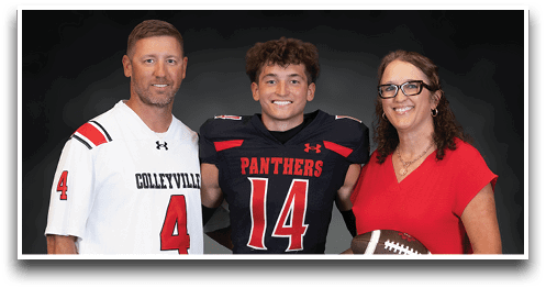 Three people stand together smiling with one wearing a black football uniform numbered 14, another in a white jersey numbered 4, and the third in a red dress holding a football. Description generated by AI