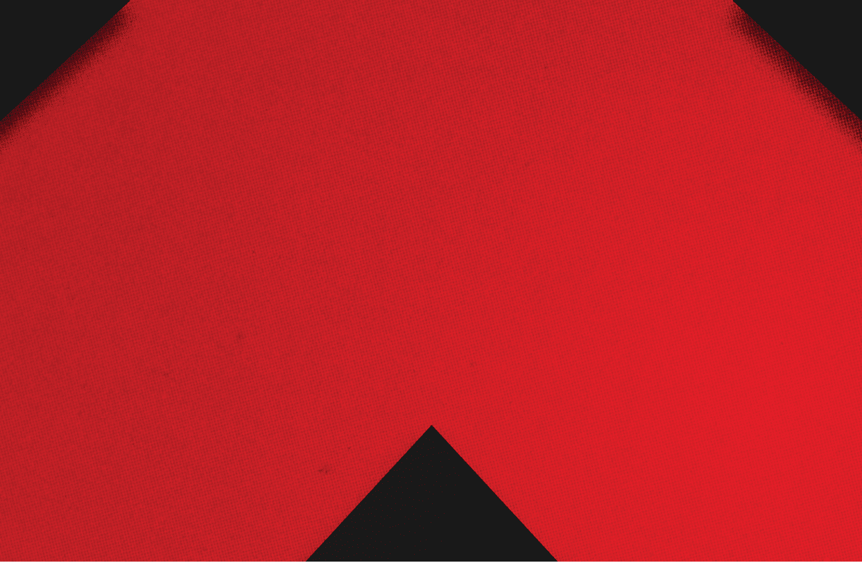 A red and black triangle. Description generated by AI