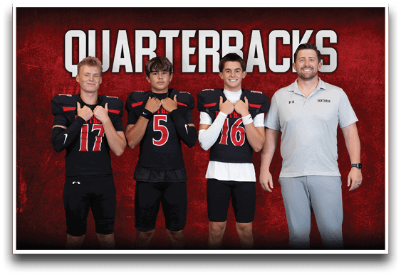 Three people in football uniforms and one person in a polo shirt stand in front of a red background with the word “QUARTERBACKS" above them. Description generated by AI