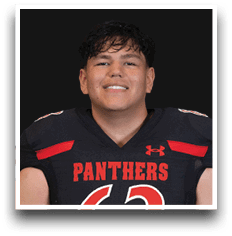 A person with short dark hair is smiling and wearing a black football jersey with red accents and the word Panthers across the chest. Description generated by AI