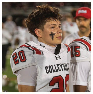 A football player wearing a blue and red jersey. Description generated by AI
