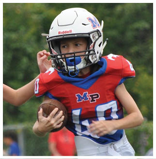 A football player wearing a blue and red jersey. Description generated by AI