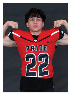 Two football players wearing black jerseys and holding hands. Description generated by AI