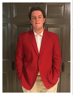 A football player wearing a blue and red jersey. Description generated by AI