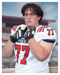 A football player wearing a blue and red jersey. Description generated by AI