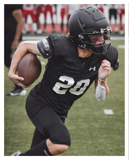 A football player wearing a blue and red jersey. Description generated by AI