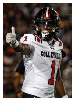 Two football players wearing black jerseys and holding hands. Description generated by AI