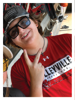 Two football players wearing black jerseys and holding hands. Description generated by AI