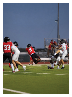 Two football players wearing black jerseys and holding hands. Description generated by AI