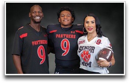 Three adults wearing sports jerseys with the number nine, one holding a football and wearing a “Senior Mom" jersey. Description generated by AI
