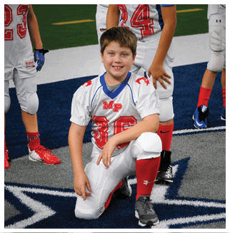 A football player wearing a blue and red jersey. Description generated by AI