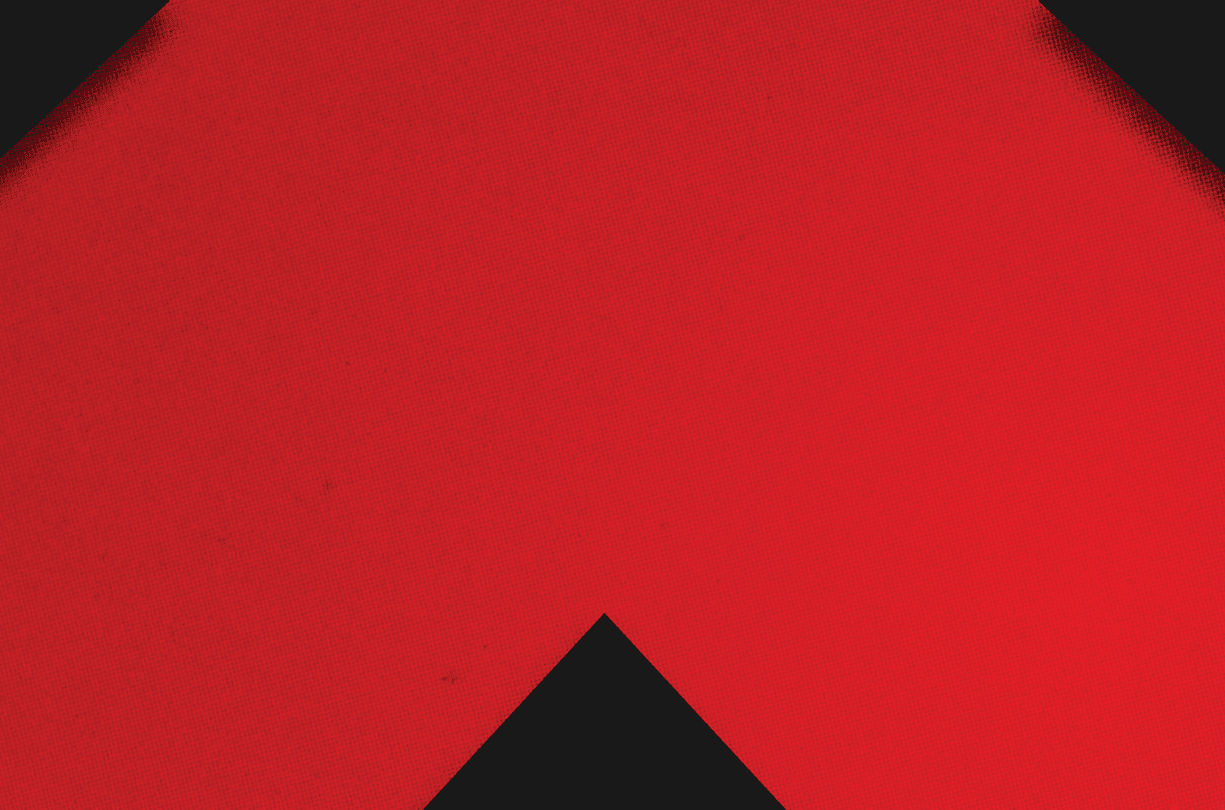 A red and black triangle. Description generated by AI