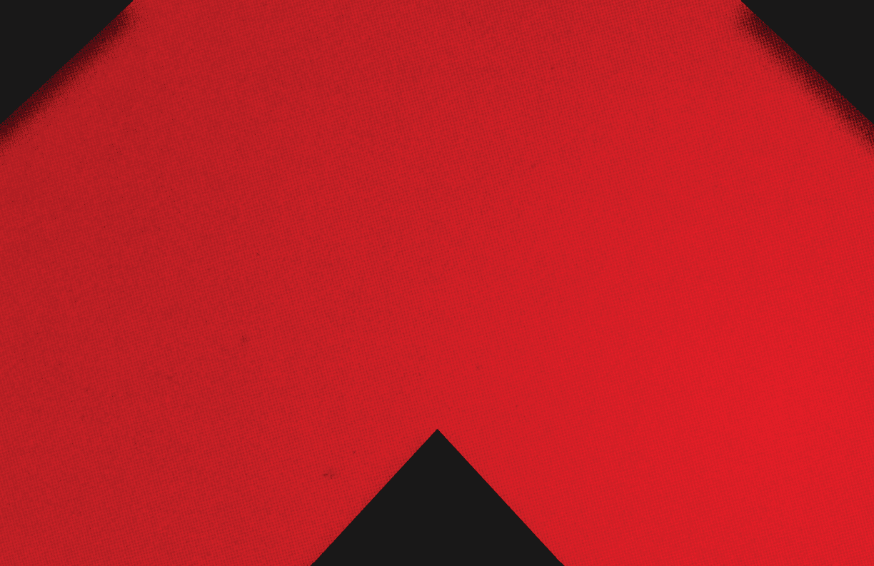 A red and black triangle. Description generated by AI