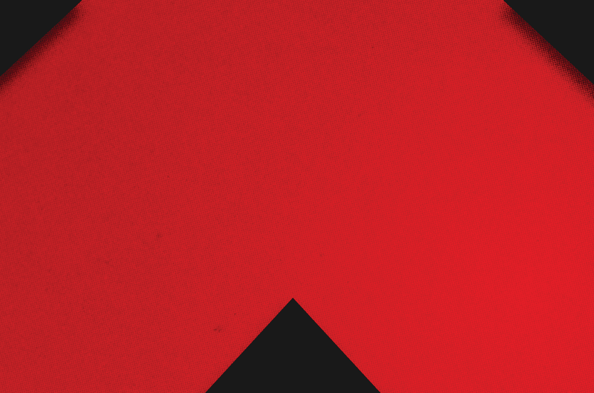 A red and black triangle. Description generated by AI