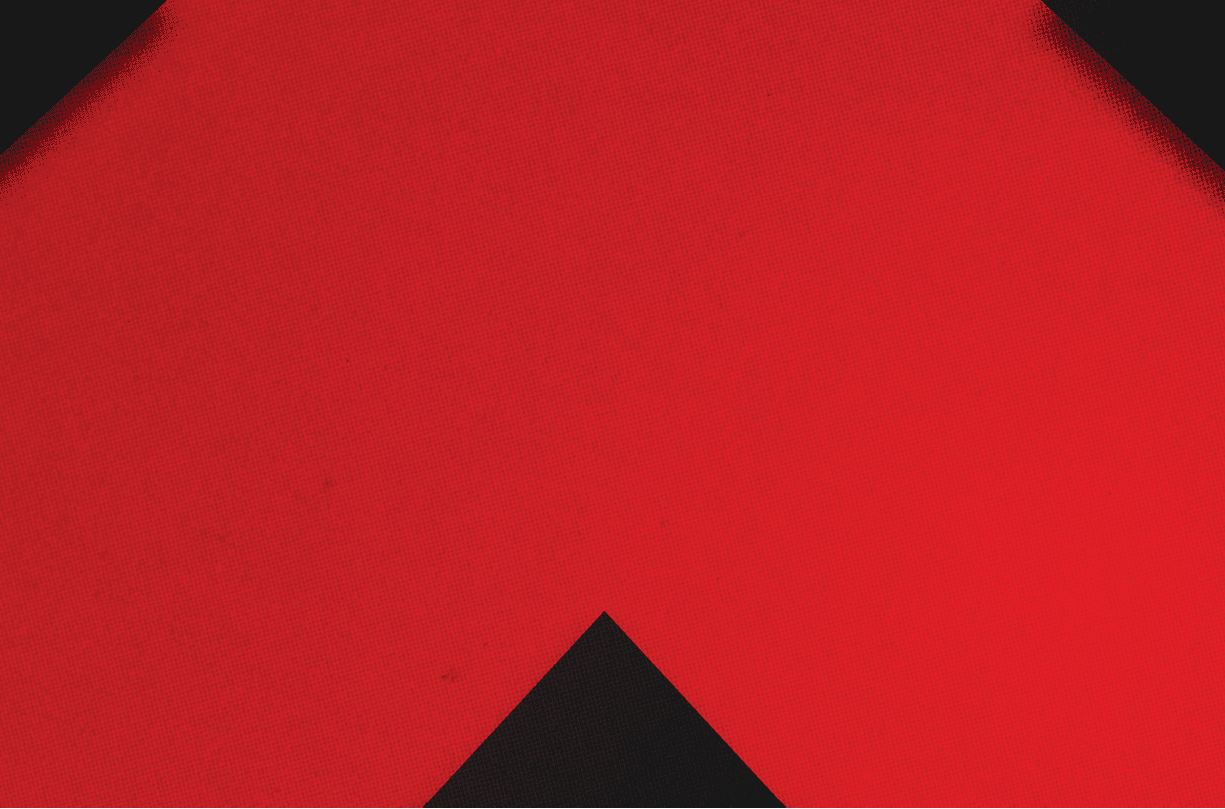 A red and black triangle. Description generated by AI